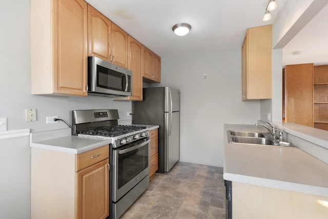 kitchen featuring sink, light brown cabinets, and appliances with stainless steel finishes