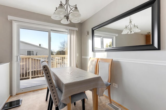 dining room with a chandelier