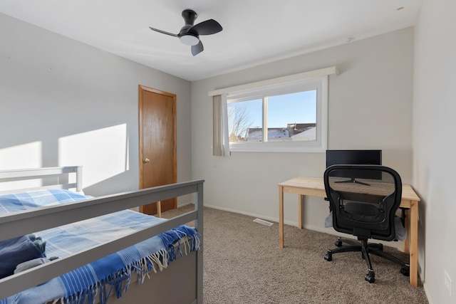 bedroom featuring ceiling fan and carpet