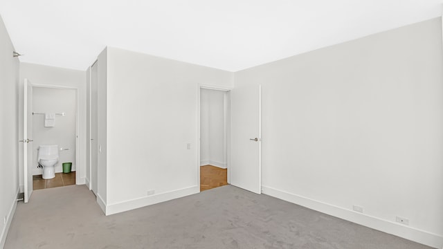 unfurnished bedroom with carpet floors