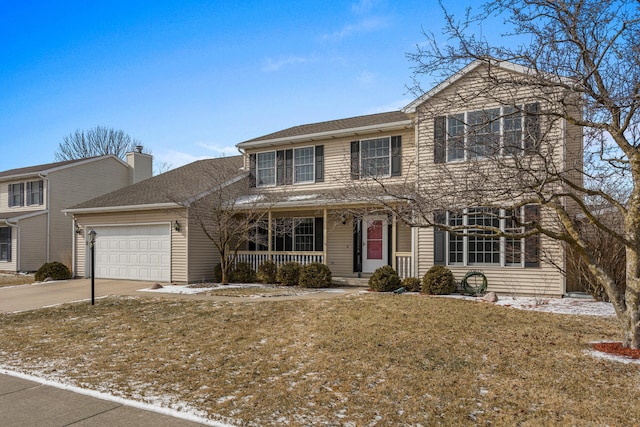 traditional home featuring a porch, concrete driveway, a front lawn, and an attached garage