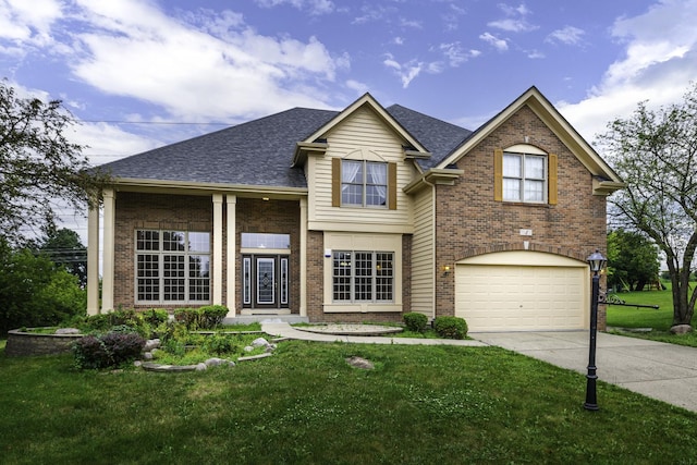 view of front of home featuring a front yard and a garage