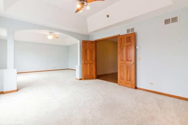 unfurnished dining area featuring sink, light hardwood / wood-style flooring, vaulted ceiling, a notable chandelier, and decorative columns