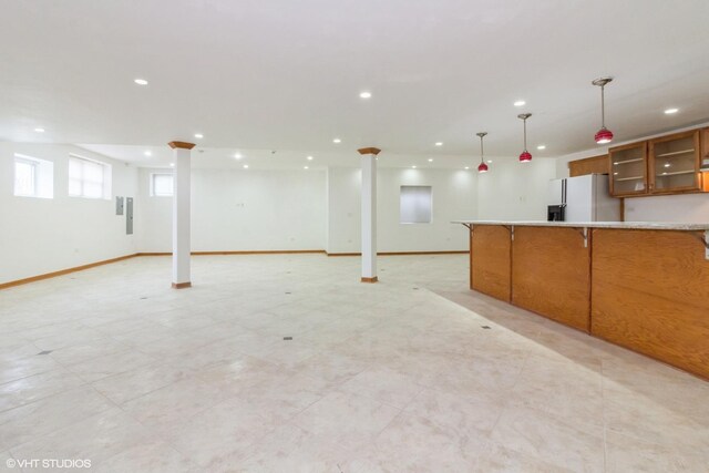 corridor featuring vaulted ceiling, dark hardwood / wood-style floors, and a notable chandelier