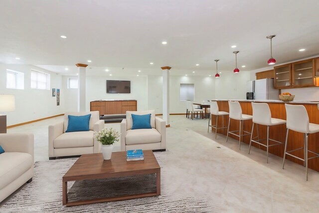 sitting room featuring ceiling fan and light carpet