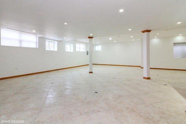 carpeted spare room featuring a tray ceiling and ceiling fan