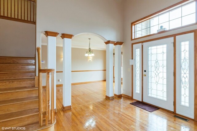 stairway with a fireplace and hardwood / wood-style flooring