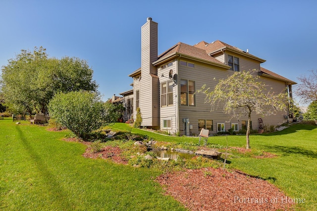 view of side of property featuring a yard