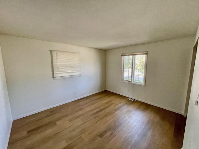 unfurnished room featuring light hardwood / wood-style flooring