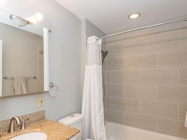 full bathroom featuring vanity, toilet, and shower / bath combo with shower curtain