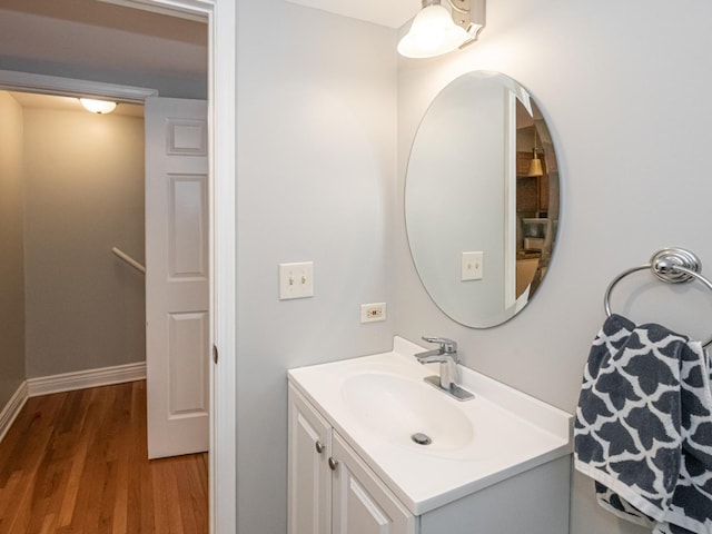 bathroom with vanity and hardwood / wood-style floors