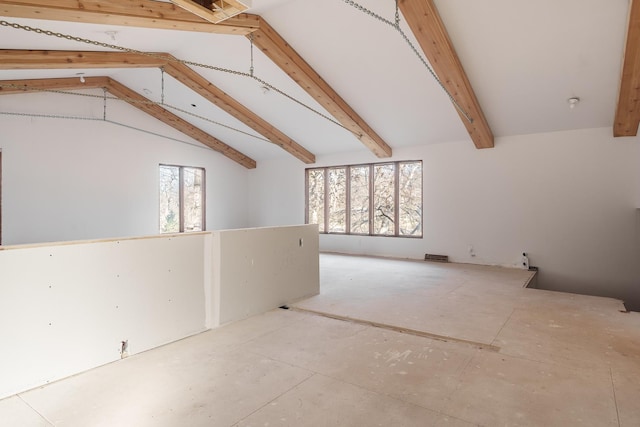 bonus room with vaulted ceiling with beams and plenty of natural light