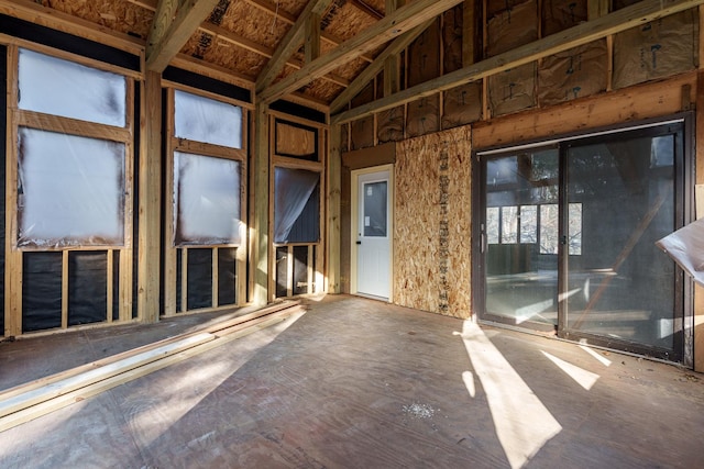 miscellaneous room featuring high vaulted ceiling