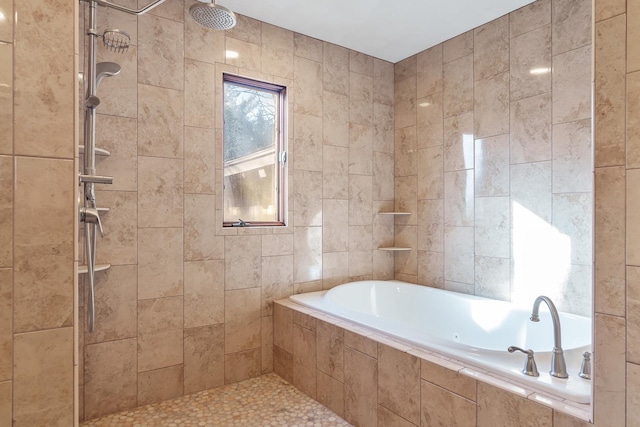 bathroom featuring separate shower and tub