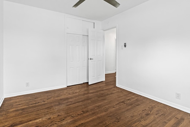 unfurnished room featuring dark hardwood / wood-style flooring and ceiling fan