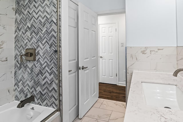 bathroom with vanity and tub / shower combination