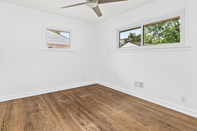 empty room with ceiling fan and wood-type flooring