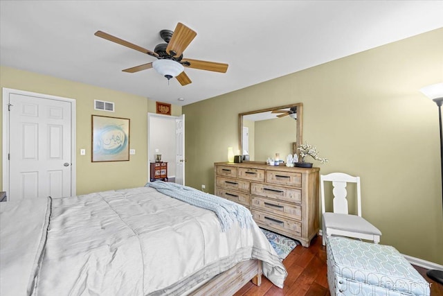 bedroom featuring ceiling fan and dark wood-type flooring