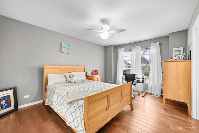 bedroom featuring ceiling fan and dark hardwood / wood-style flooring