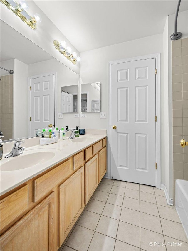 bathroom featuring tile patterned flooring and vanity