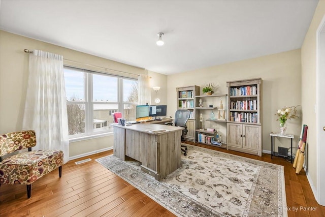 office space with light hardwood / wood-style floors