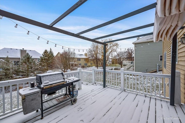 snow covered deck with grilling area