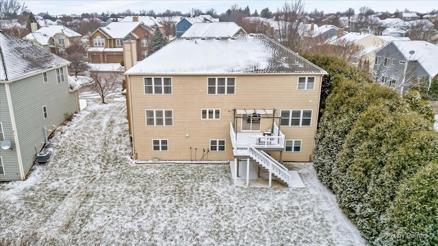 rear view of house with central AC