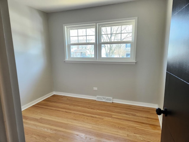 unfurnished room featuring light hardwood / wood-style flooring