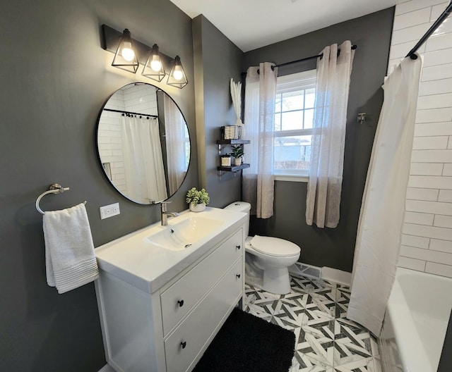 full bathroom with vanity, toilet, and shower / bath combo with shower curtain