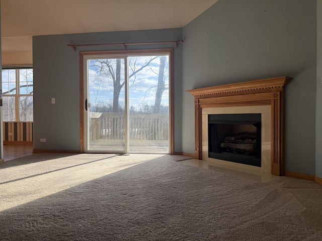 unfurnished living room with carpet flooring and lofted ceiling