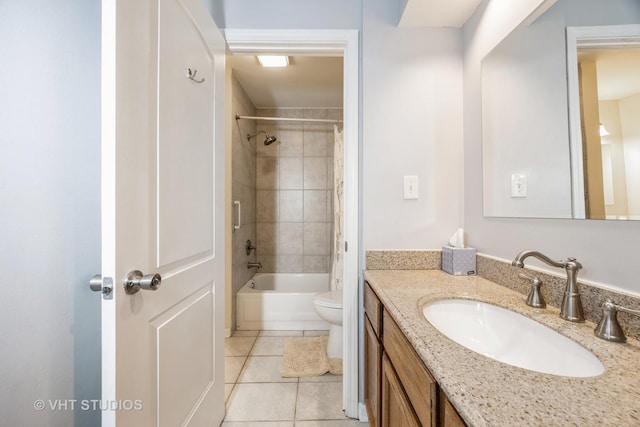 full bathroom with toilet, vanity, tiled shower / bath combo, and tile patterned flooring