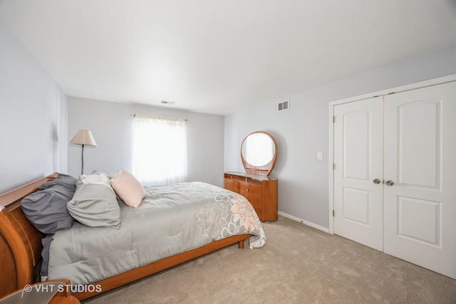 carpeted bedroom featuring a closet