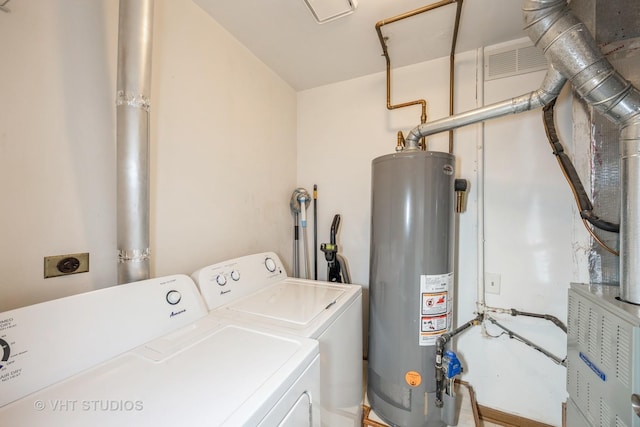 washroom featuring washer and clothes dryer and gas water heater