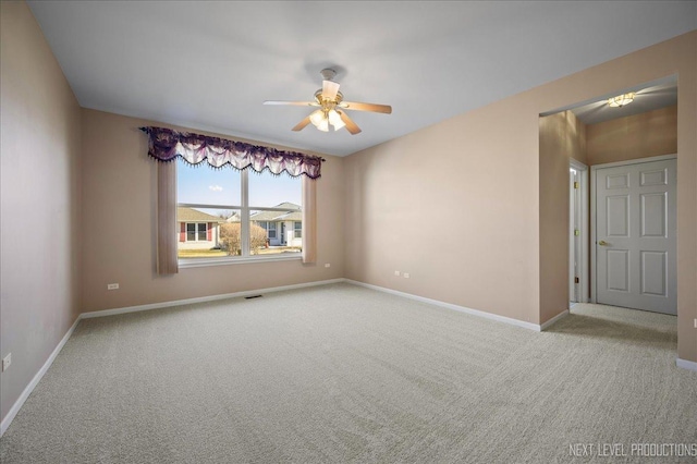 carpeted empty room with ceiling fan