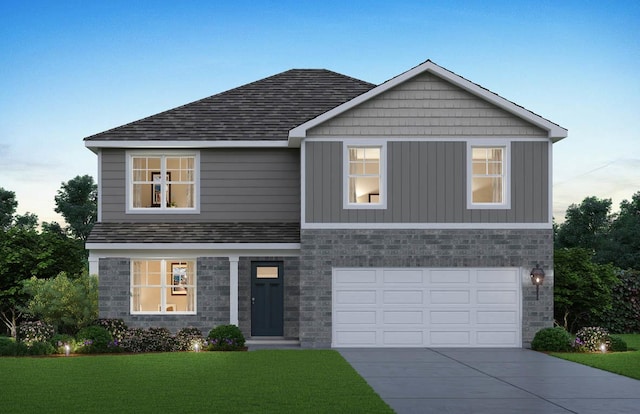 view of front of home with a garage and a front yard