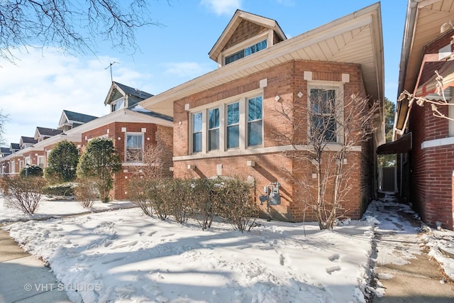 view of front of house featuring brick siding