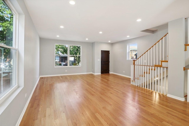 unfurnished living room with light hardwood / wood-style flooring