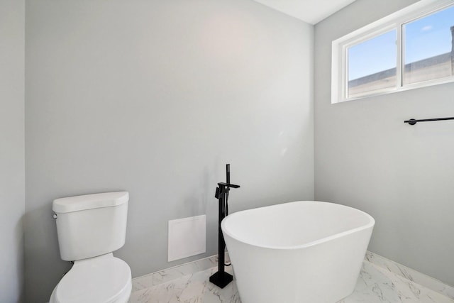 bathroom with a bathtub and toilet