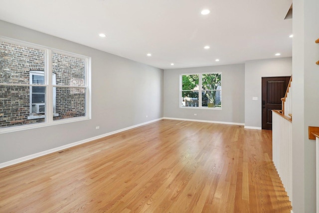 empty room featuring light hardwood / wood-style flooring and cooling unit