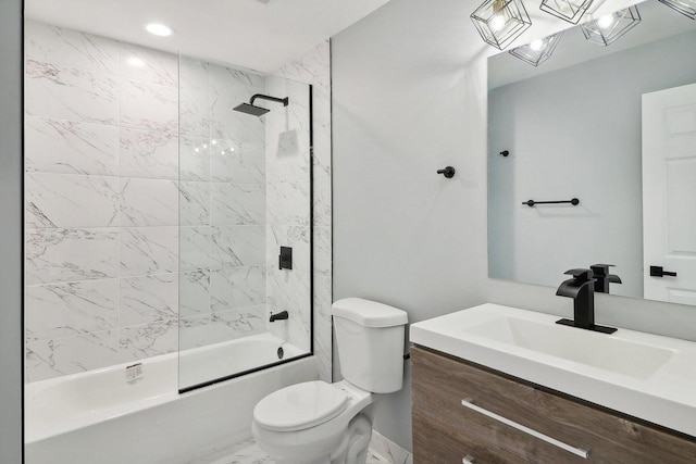 full bathroom with vanity, tiled shower / bath combo, and toilet