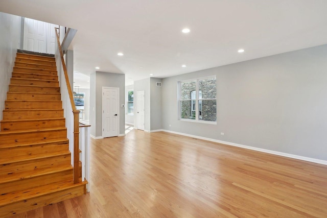 unfurnished living room with light wood-type flooring