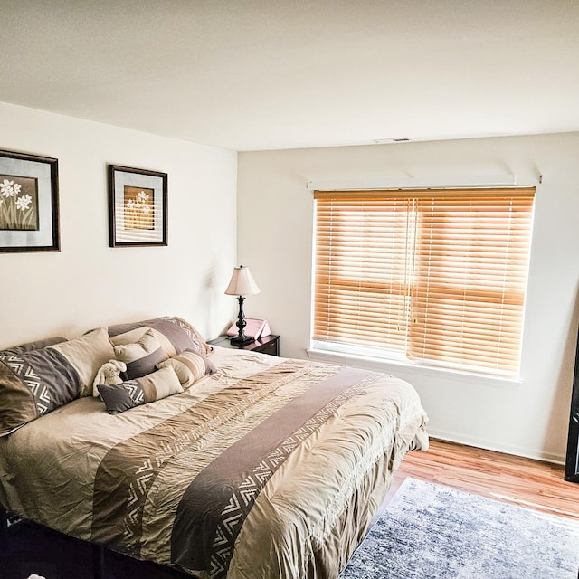 bedroom featuring light wood-type flooring