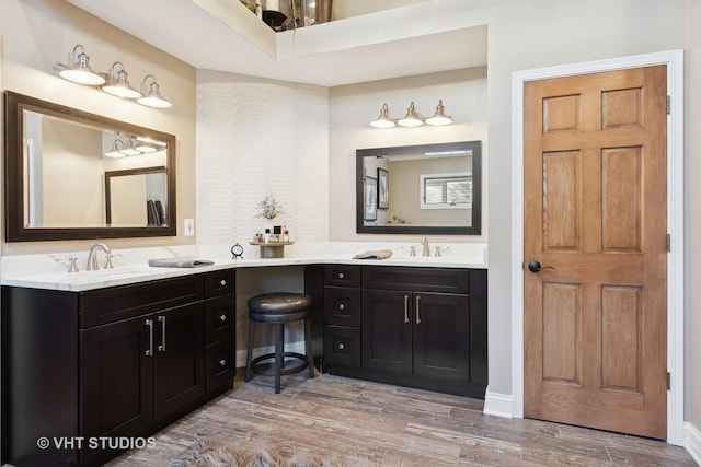 full bath featuring wood finished floors and vanity