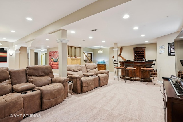 home theater room featuring a dry bar, recessed lighting, visible vents, and ornate columns