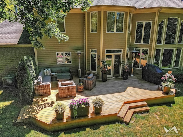 rear view of house with cooling unit, roof with shingles, a deck, and an outdoor hangout area