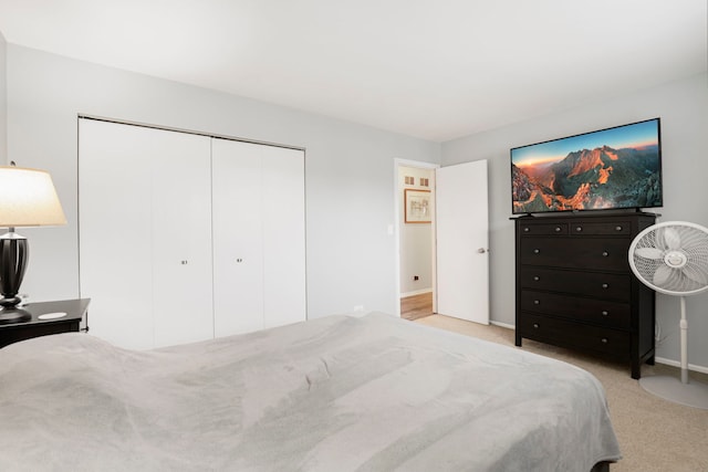 carpeted bedroom featuring a closet