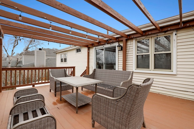 wooden deck featuring an outdoor living space and a pergola