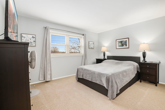 bedroom featuring light carpet