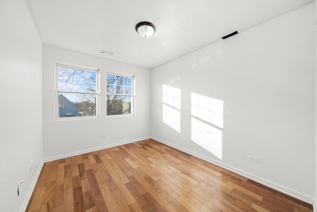 empty room featuring hardwood / wood-style floors