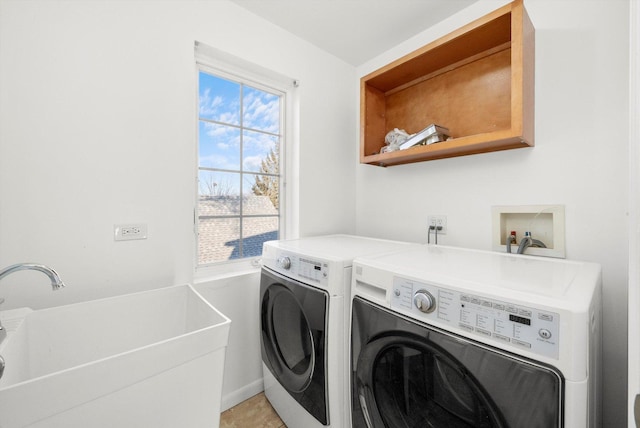 washroom featuring washer and clothes dryer, light tile patterned floors, and sink